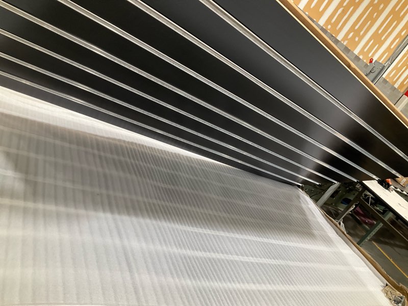 Condition photo showing As Is for slatwall panels with aluminum reinforcement strips heavy duty 4’x4’ mdf black slat wall paneling for retail display, garage tool storage, guitar shop, home storage, wood slat wall paneling board