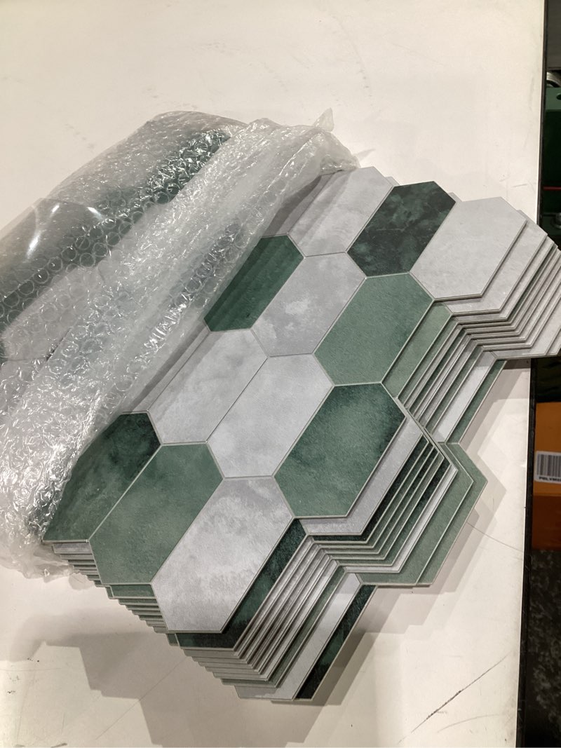 Condition photo showing Good Condition for The Tiles Plaza 10-Sheet Peel and Stick Backsplash, 12" x 11.5" Green Cement Long Hexagon Self Adhesive Wall Tile, Stone Composite Stick On Decorative Mosaic Tile for Kitchen Bathroom Fireplace