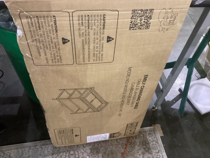 Condition photo showing As Is for Dream On Me Emily Changing Table In Black, Comes With 1" Changing Pad, Features Two Shelves, Portable Changing Station, Made Of Sustainable New Zealand Pinewood