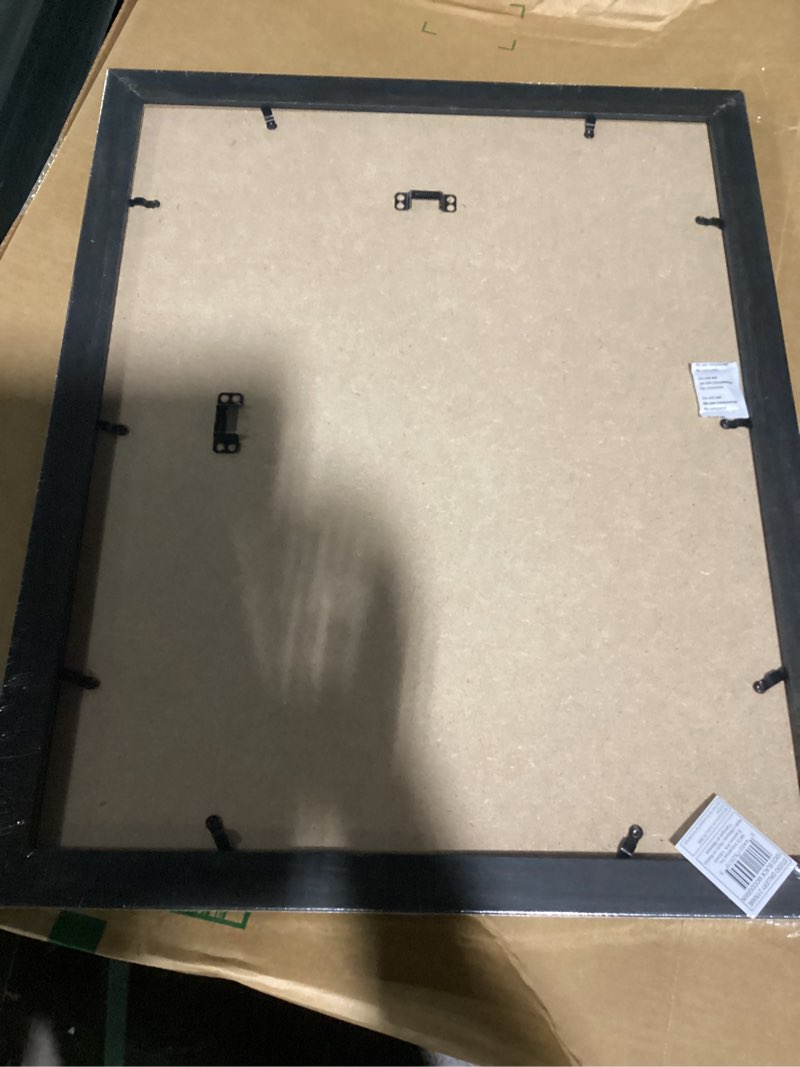 Condition photo showing Good Condition for mcs studio gallery classic 16x20 poster frame black woodgrain engineered wood, vertical & horizontal wall hanging large picture frame for photos, posters & art prints (1-pack) 16x20 black woodgrain
