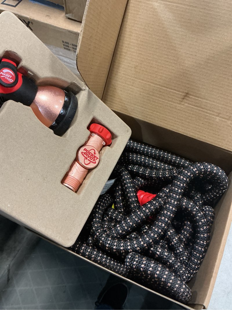 Condition photo showing New/Like New for pocket hose 75 ft copper head expandable garden hose with pocket pivot, no tangles, as seen on tv, 360° swivel, tri-tex tubing, force field jacket, lead-free, no-kink, anti-burst w/apt regular 75 ft
