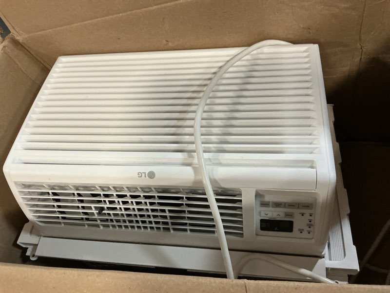 Condition photo showing As Is for 5,800 btu window air conditioner | cools up to 260 sq. ft