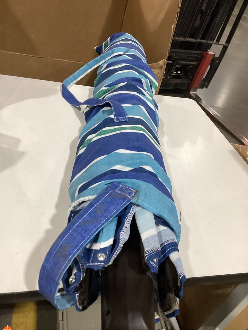 Condition photo showing As Is for blue outside patio umbrella