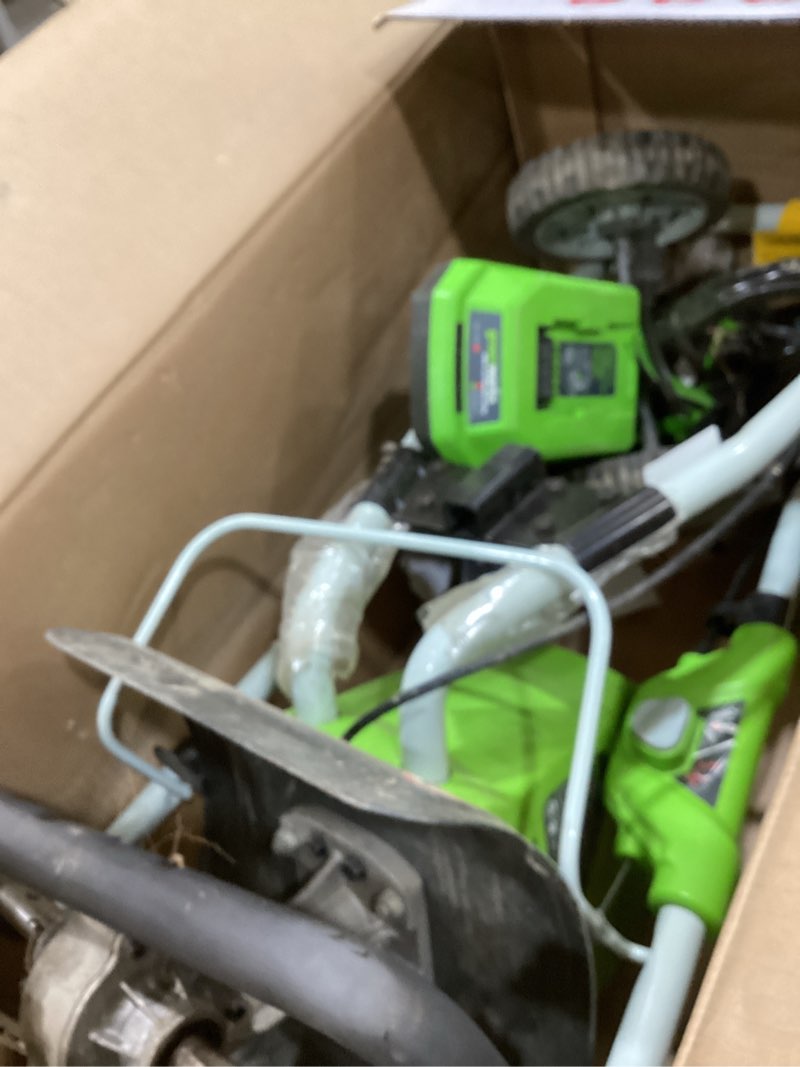 Condition photo showing As Is for greenworks 40v 10" cordless tiller / cultivator, 4.0ah battery and charger included, green 4ah battery and charger soil tiller cultivator