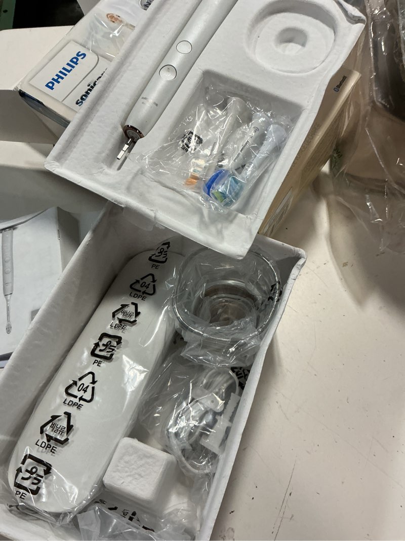 Condition photo showing New/Like New for philips sonicare diamondclean smart 9500 electric toothbrush - sonic toothbrush with app, pressure sensor, 15 brushing settings, replacement reminder, usb charging travel case, rose gold, hx9923/61 1 count (pack of 1) new rose gold