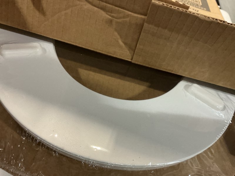 Condition photo showing New/Like New for Mayfair Padded Toilet Seat with Chrome Hinges, Soft Vinyl over Wood Core Seat, Made in USA, Round, White Elongated Seat