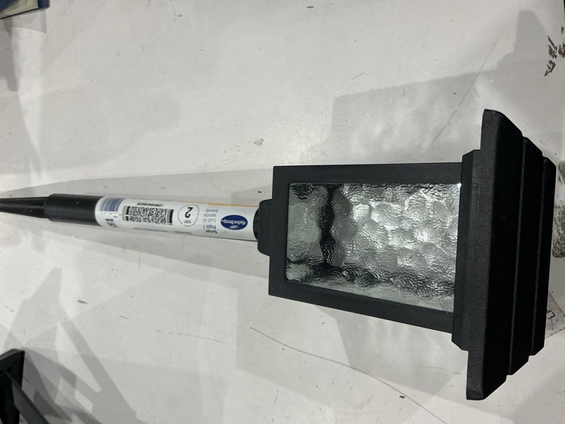 Condition photo showing As Is for harbor breeze 15lm solar path light 15 -lumens black solar led outdoor path light ( 3000-k )