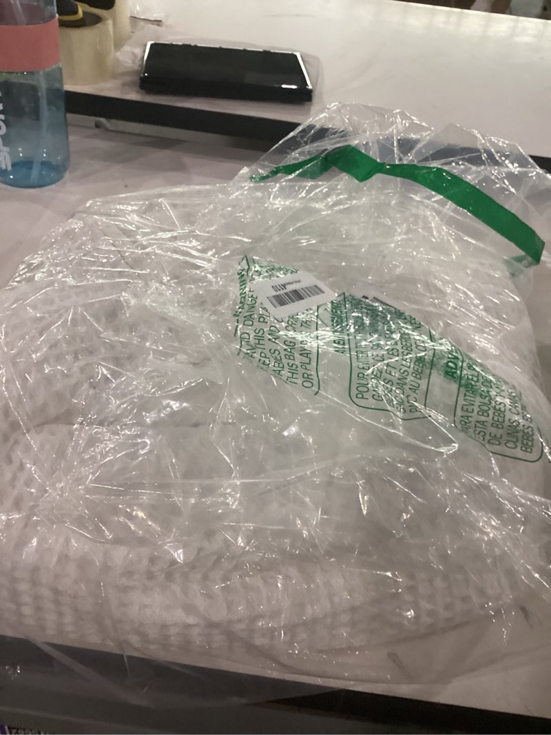 Condition photo showing As Is for white blanket unknown size
