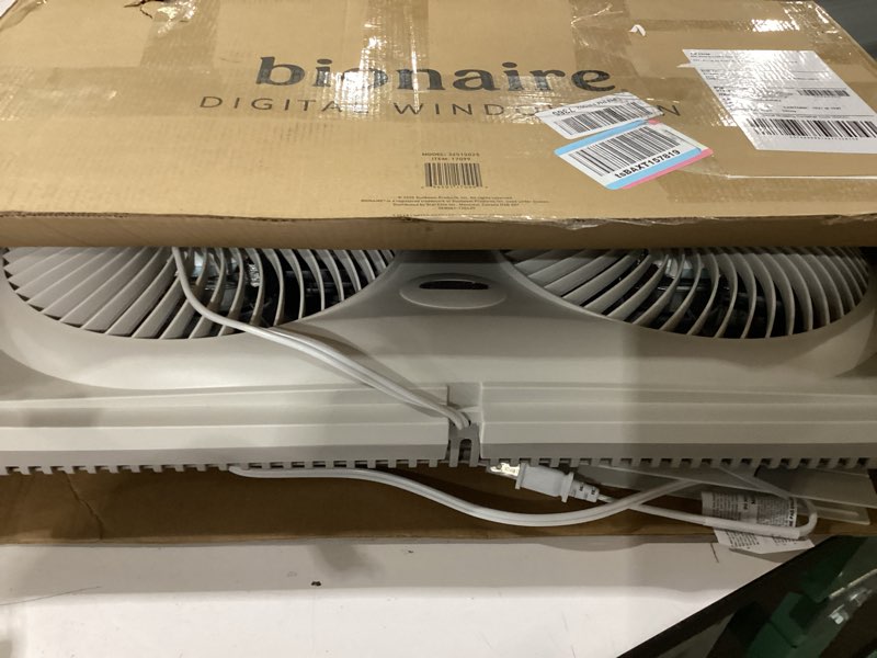 Condition photo showing As Is for bionaire window fan with reversible airflow blades – 3-speed settings, programmable thermostat, led display, remote control, fits 24–36" windows, no assembly required white 2 blades electronic control with lcd screen window fan