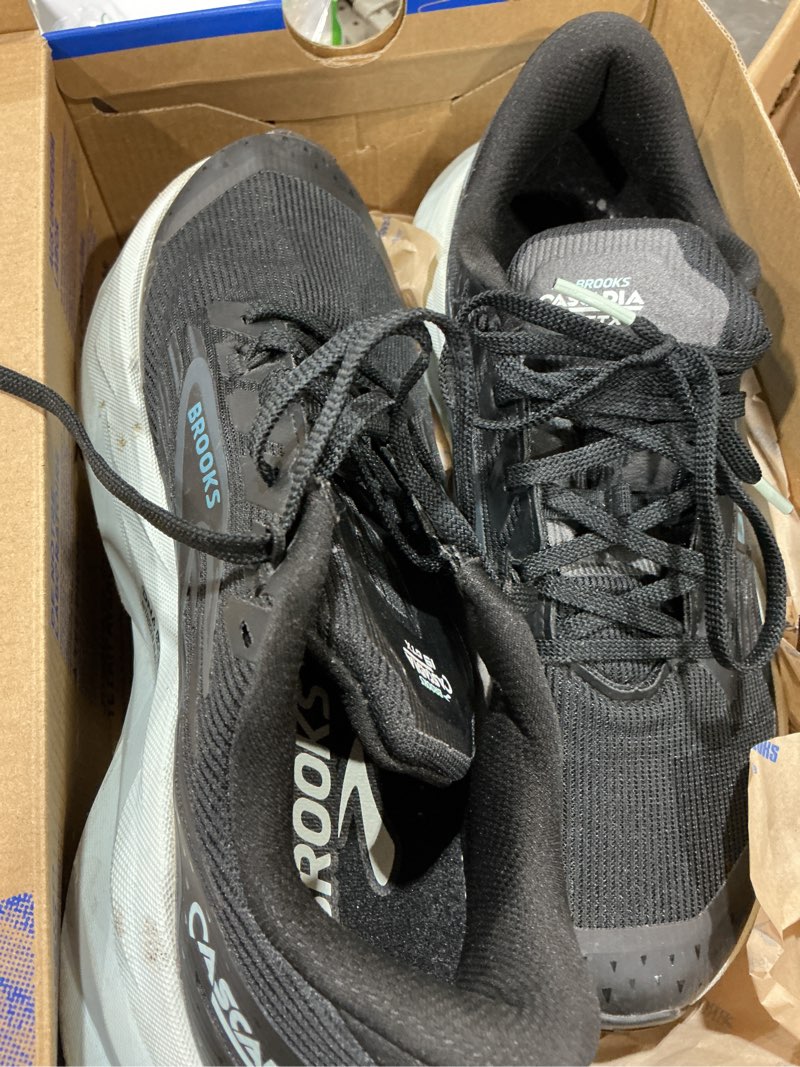 Condition photo showing As Is for brooks women’s cascadia 19 gtx waterproof mountain trail running shoe 8.5 black/ebony/blue flower