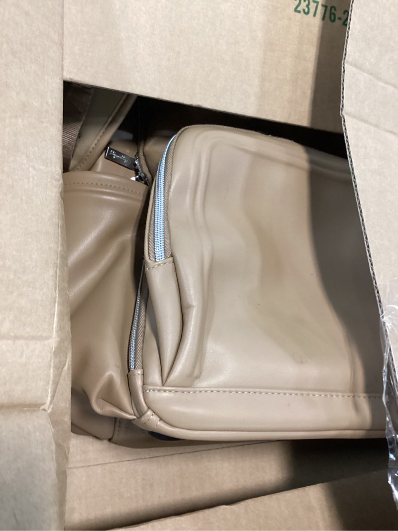 Condition photo showing Good Condition for itzy ritzy diaper bag backpack – large capacity boss plus baby backpack diaper bag featuring 19 pockets, changing pad, stroller clips, and comfortable straps (chai)