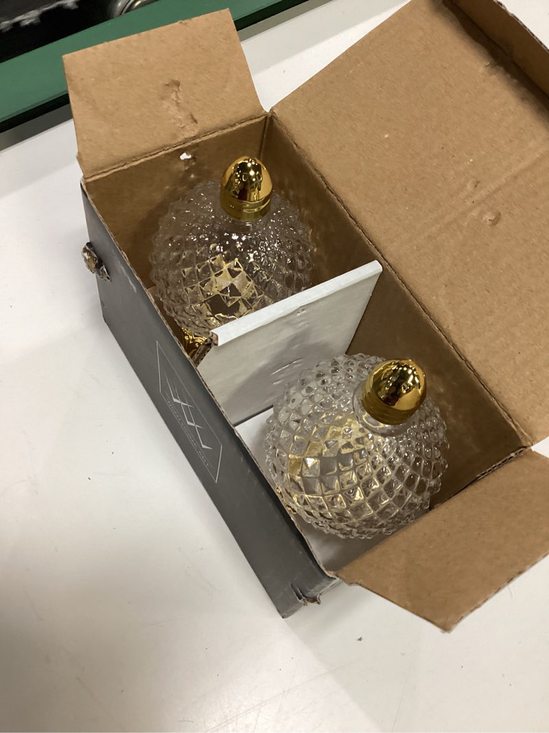 Condition photo showing Good Condition for crystal glass salt and pepper shakers with gold metal stand and lid, diamond cut design, 4.33 inches height, 2 piece set