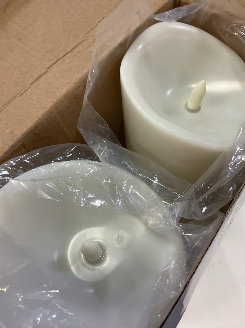 Condition photo showing New/Like New for homemory 4"x12" outdoor waterproof flameless candles with timers and remote control, battery operated candles, led plastic candles, ivory white, set of 2 4"x12" ivory white