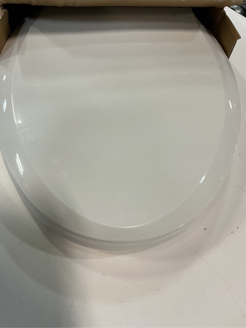 Condition photo showing Good Condition for 19" elongated toilet seat with built-in potty training seat, soft quiet-close lid with non-slip design, magnetic kids seat in white, easy to install and clean elongated (19?) white, with toddler seat