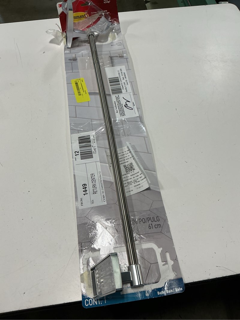 Condition photo showing As Is for 24 in. wall mounted towel bar in satin nickel