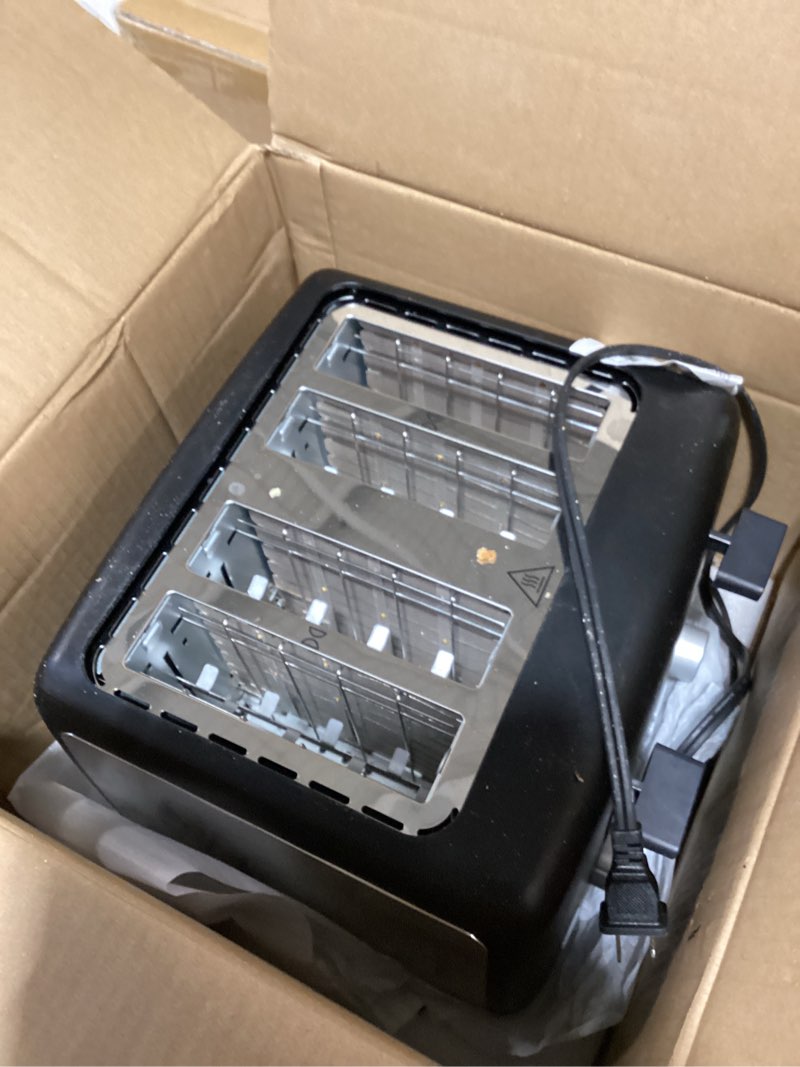 Condition photo showing As Is for Amazon Basics 4 Slice Toaster, With 7 Browning Settings, Extra Wide Slots For Bagels and Special Breads, Removable Easy-to-Clean Crumb Trays, Cancel/Defrost/Bagel Buttons, 1500W, Black & Silver 4 Slice Matte Black Front
