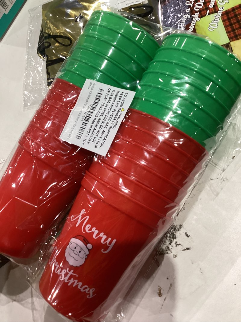 Condition photo showing New/Like New for christmas party cups set - 24-pack red & green plastic cups with festive holiday designs, includes matching straws for xmas celebrations (santa, grinch, elf themes)