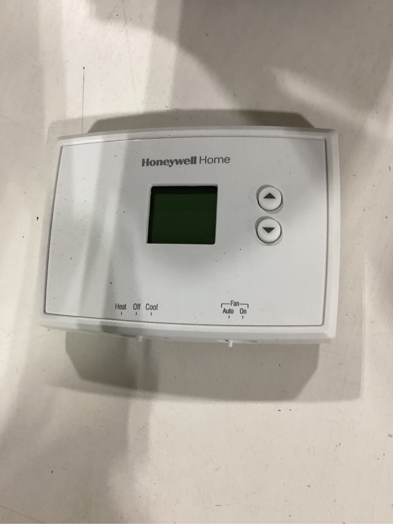 Condition photo showing As Is for honeywell home electronic non-programmable thermostat