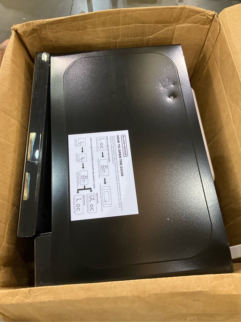 Condition photo showing As Is for BLACK+DECKER EM720CB7 Digital Microwave Oven with Turntable Push-Button Door, Child Safety Lock, 700W, Stainless Steel, 0.7 Cu.ft