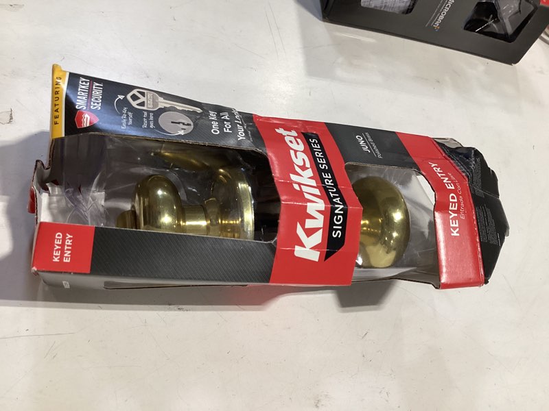 Condition photo showing As Is for kwikset smartkey juno polished brass entry door knob kw1 1-3/4 in.