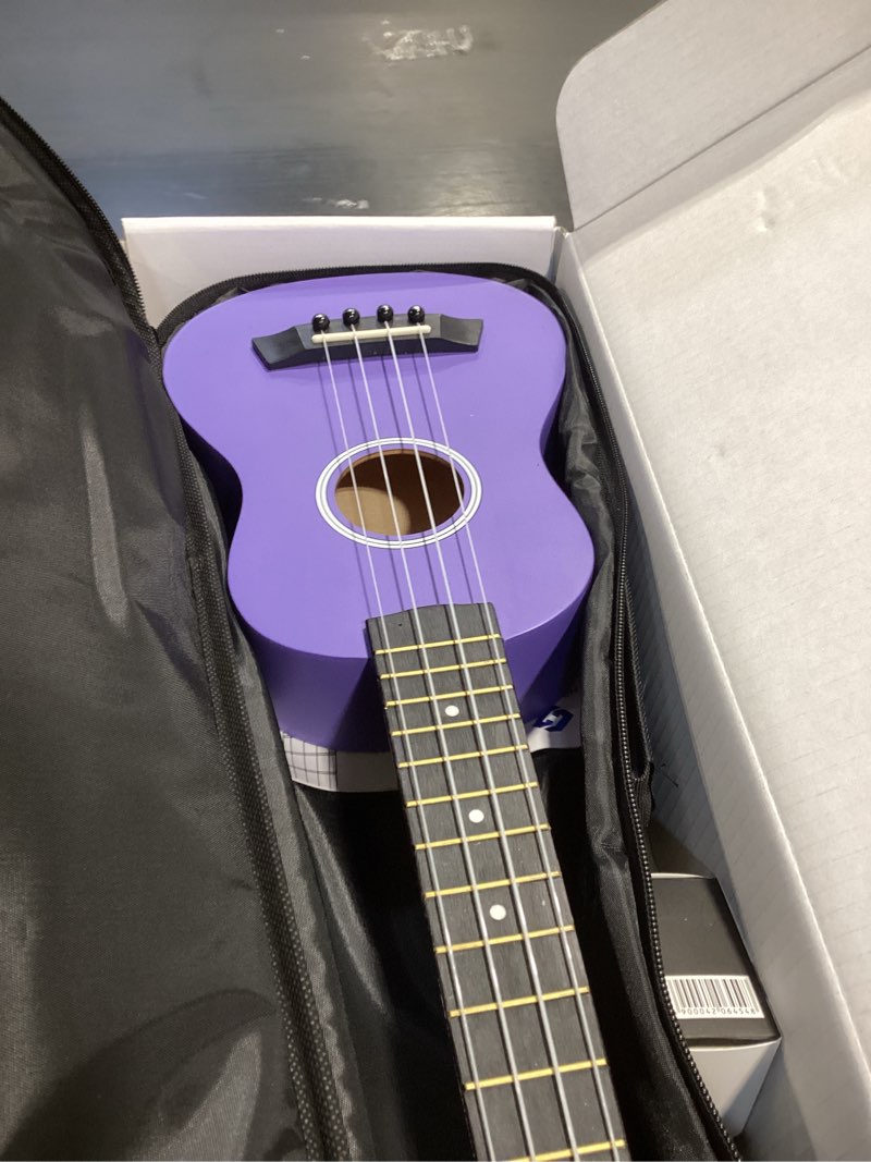 Condition photo showing Good Condition for Soprano Ukulele Beginner Pack, 21 Inch Basswood kids Ukuleles Starter Kit with Gig Bag Spare Strings Tuner and Picks. (purple) 21 inch purple