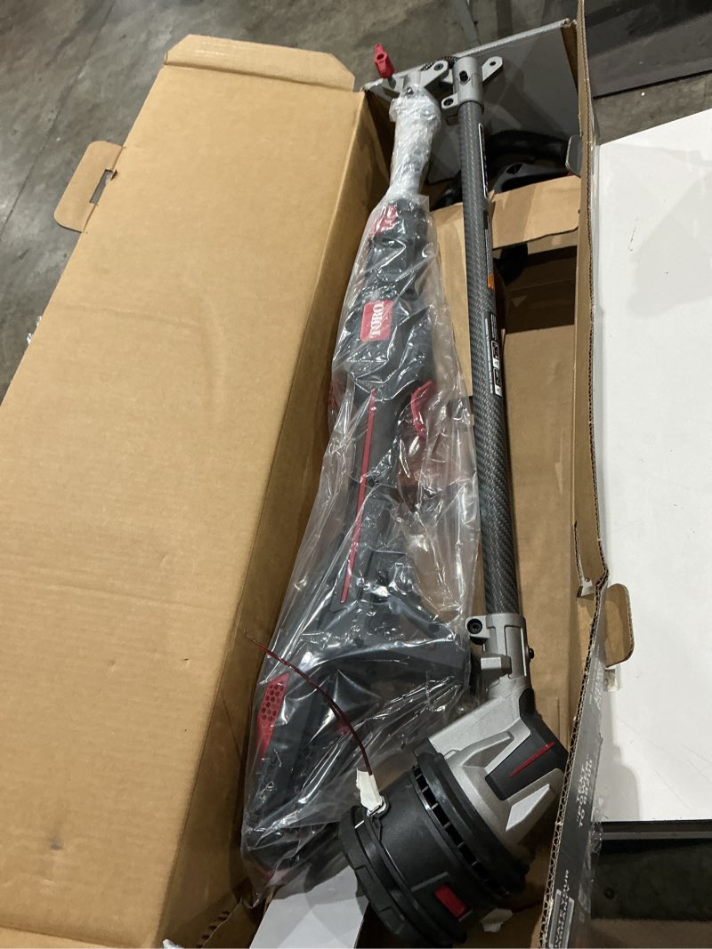 Condition photo showing As Is for toro 51838 17 in. 60 v battery string trimmer kit (battery & charger)