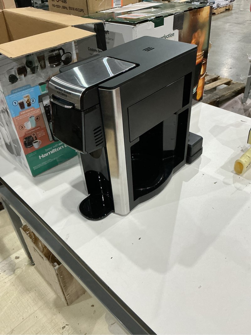 Condition photo showing As Is for hamilton beach flexbrew advanced 5-in-1 programmable 12 cup drip and single serve hot & iced coffee maker with movable 60 oz. water reservoir, use pod packs and grounds, fast brewing, black (49924)