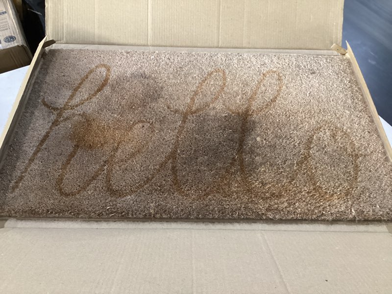 Condition photo showing As Is for dii hello coir fiber doormat non-slip durable outdoor/indoor, pet friendly, 17.5x29.5, yellow