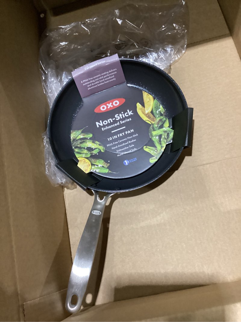Condition photo showing As Is for OXO Enhanced 10" Frying Pan Skillet, PFAS-Free Ceramic Nonstick, Durable Hard Anodized Cookware, Scratch Resistant, Stainless Steel Handle, Good Grips, Dishwasher Safe, Oven safe, Black 10" Frying Pan Skillet Black