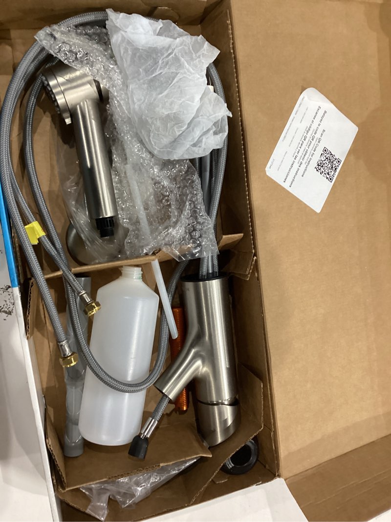 Condition photo showing As Is for Moen Sombra Spot Resist Stainless Single-Handle Pull-Out Sprayer Kitchen Faucet with Soap Dispenser and Power Clean, 87701SRS