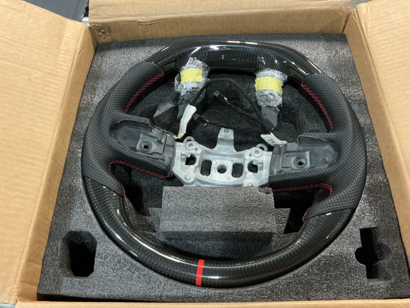 Condition photo showing Good Condition for real carbon fiber steering wheel d-shaped with heating functionnappa perforated leather flat-bottom steering wheel for dodge ram 1500 trx 2021-2024 -with paddle holes