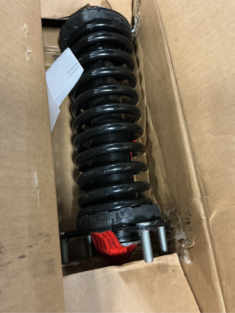 Condition photo showing As Is for monroe quick-strut 171577l suspension strut and coil spring assembly for jeep liberty