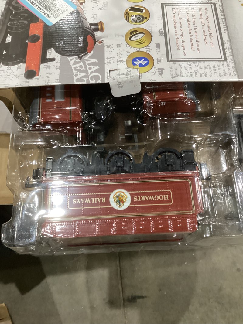 Condition photo showing As Is for Lionel Battery-Operated Hogwarts Express Toy Train Set with Bluetooth, Locomotive, Train Cars, & Track with Authentic Train Sounds, Lights, & Water Vapor Smoke Effects for Kids 4+