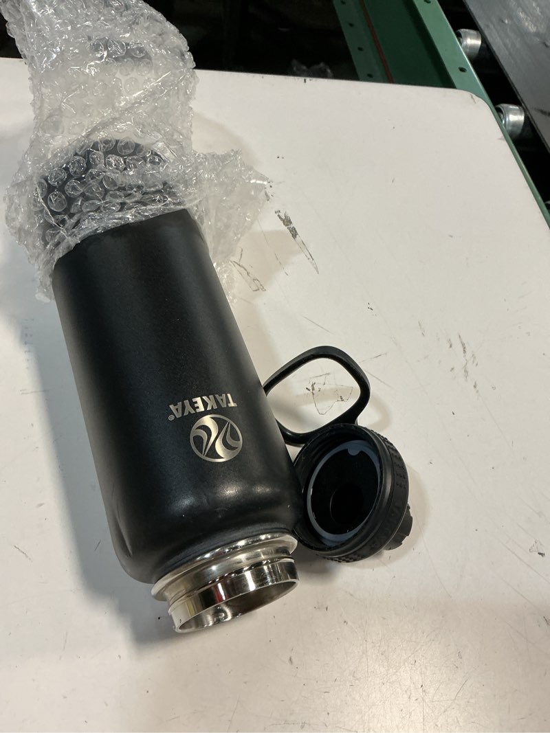 Condition photo showing As Is for takeya actives water bottle with spout lid - bottle with double stainless steel insulation - dishwasher safe & bpa-free - bottle with spout lid & removable bumper - 24 oz, onyx onyx 24 ounces