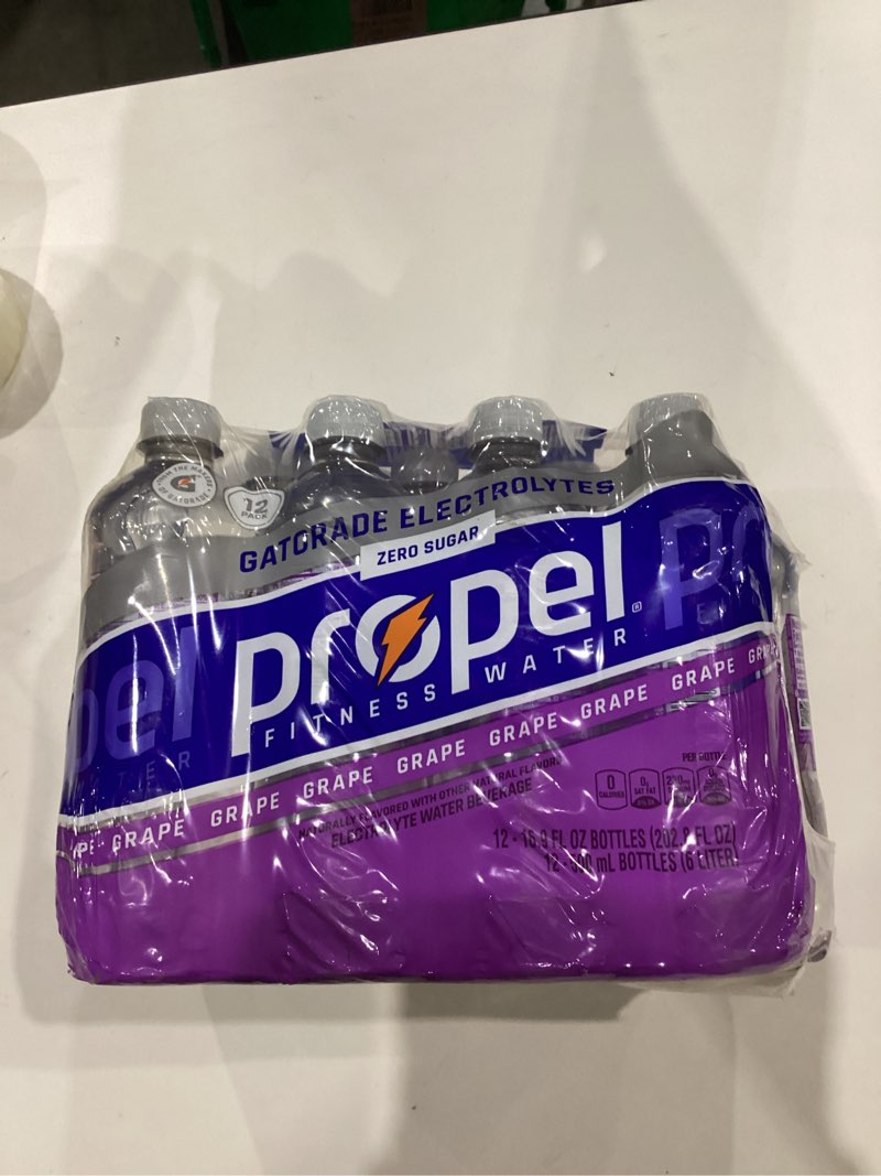 Condition photo showing As Is for Propel, Grape, Zero Calorie Sports Drinking Water with Electrolytes and Vitamins C&E, 16.9 Fl Oz (Pack of 12)