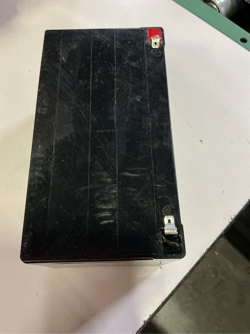 Condition photo showing As Is for ottaro 24v 7ah battery for ride on car utv