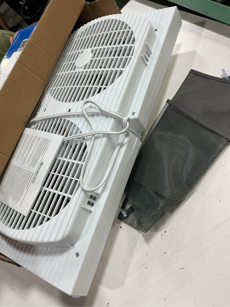 Condition photo showing As Is for comfort zone twin window fan with reversible airflow control, 9 inch, auto-locking expanders, 2 speed fan, dual fan, exhaust, airflow 9.84 ft/sec, ideal for home, kitchen, bedroom & office, cz319wt white 9"