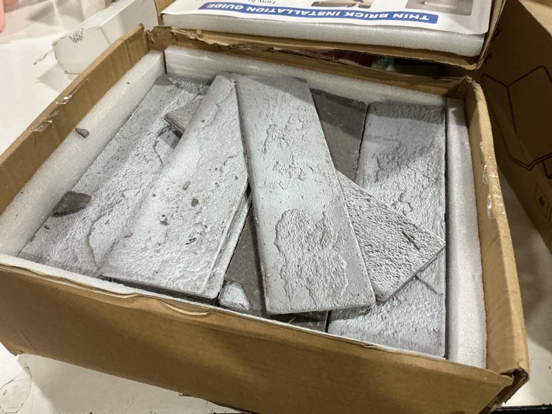 Condition photo showing As Is for 100 whitewash grey faux brick wall tiles, 3d thin brick veneers for bedroom, bathroom, kitchen, fireplace and fence wall panels (14.2 sq ft) 100 pieces, 8.66"x2.36"x0.15" whitewash grey