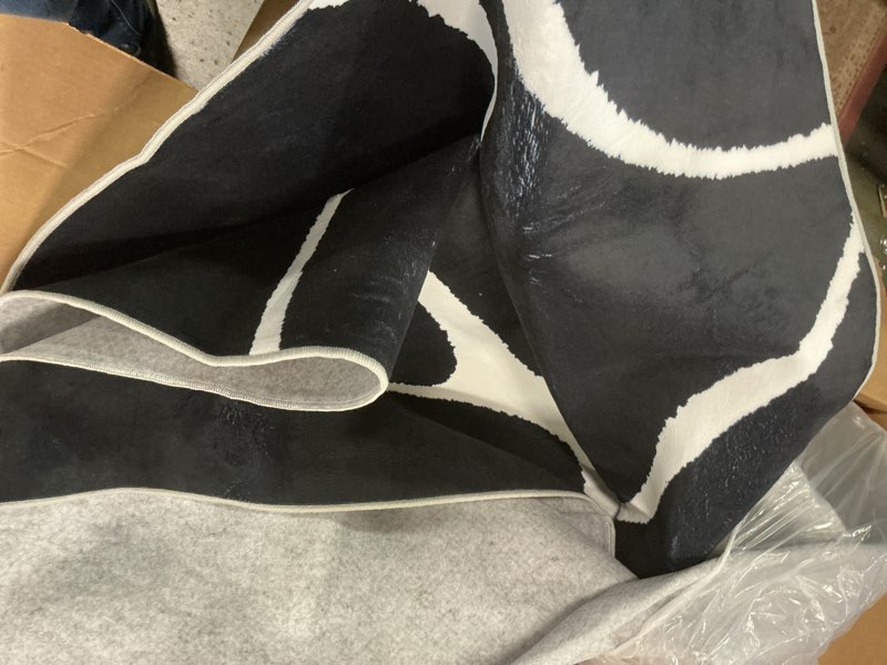 Condition photo showing As Is for YIHOUSE Black Modern Area Rugs 8x10,Large Black and White Rugs for Living Room,Wave Washable Rug 8x10,Thin Abstract Geometric Rug,Minimalist Striped Rugs for Bedroom,Office Black Curved Lines-1 8' x 10' (Rectangular)