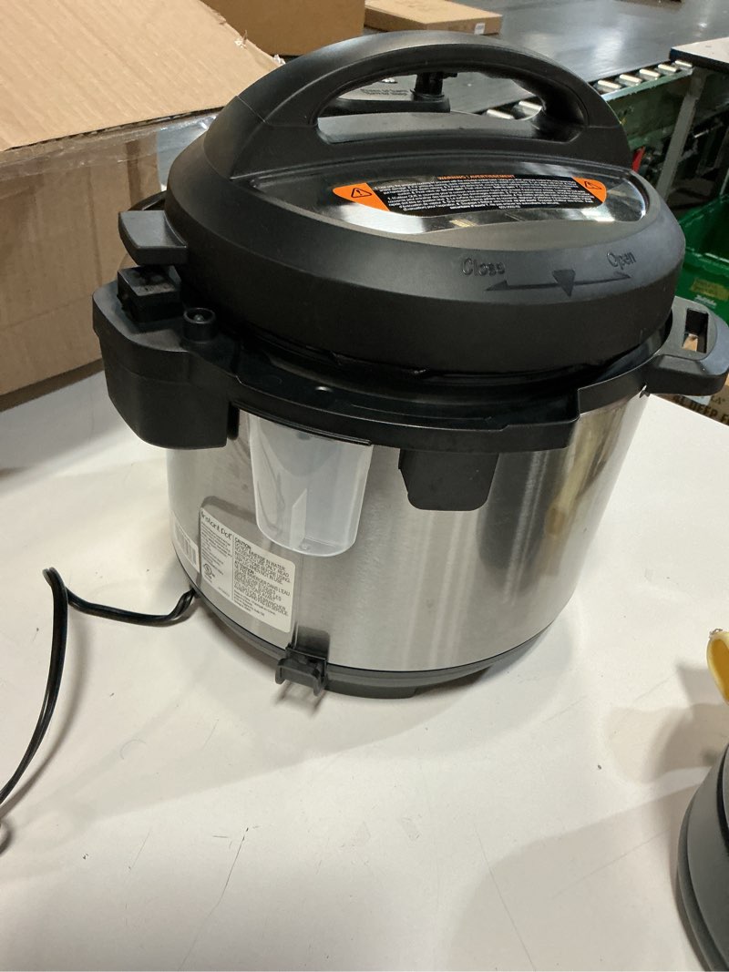 Condition photo showing As Is for instant pot duo - 7-in-1 pressure cooker + yogurt maker. pressure cooking, slow cooking, rice, yogurt, steam, sauté and keep warm. 6 quart / 5.7 l. stainless steel