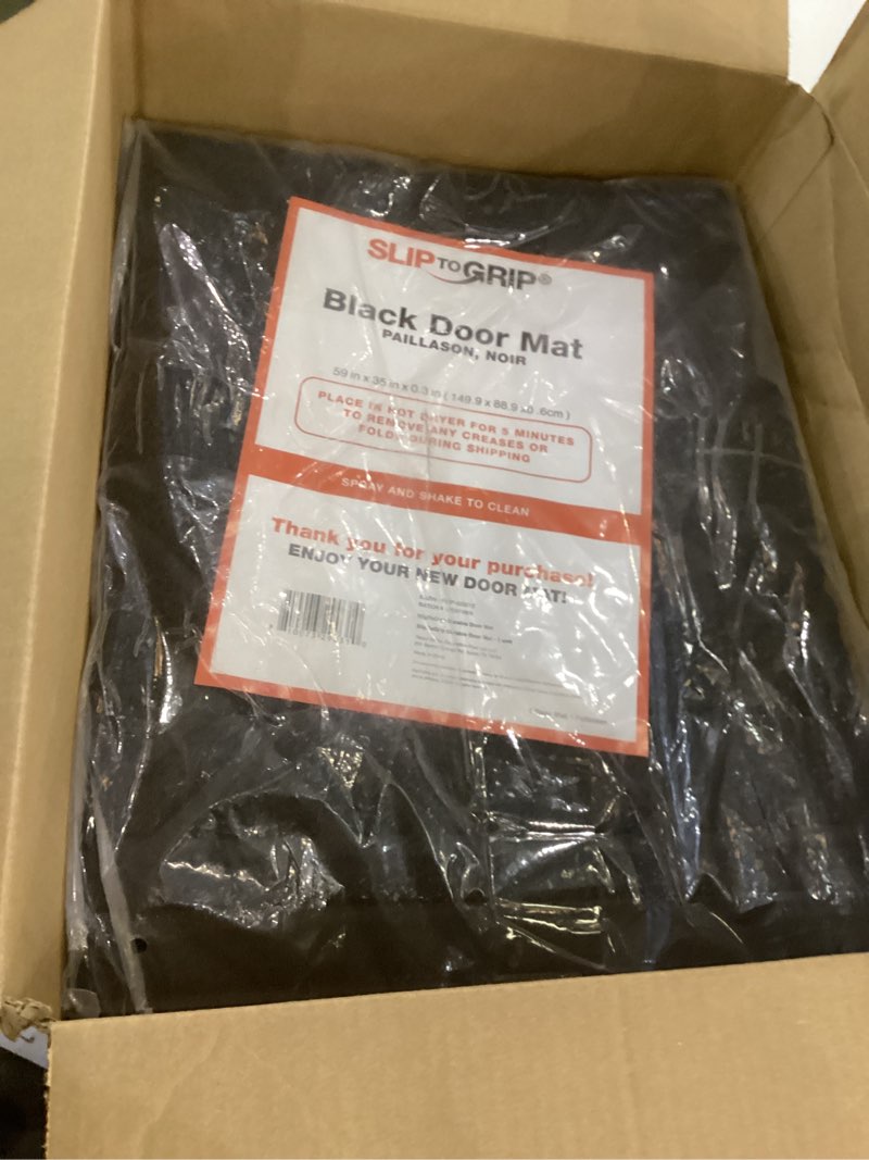 Condition photo showing item condition for SlipToGrip Door Mat - Durable Door Outdoor Mats for High Traffic - Large 59x35 Inch Black Mat with Water-Resistant Surface - No-Slip and Easy-to-Clean for Indoor and Outdoor Entryways 59" x 35" (1 Pack) Black