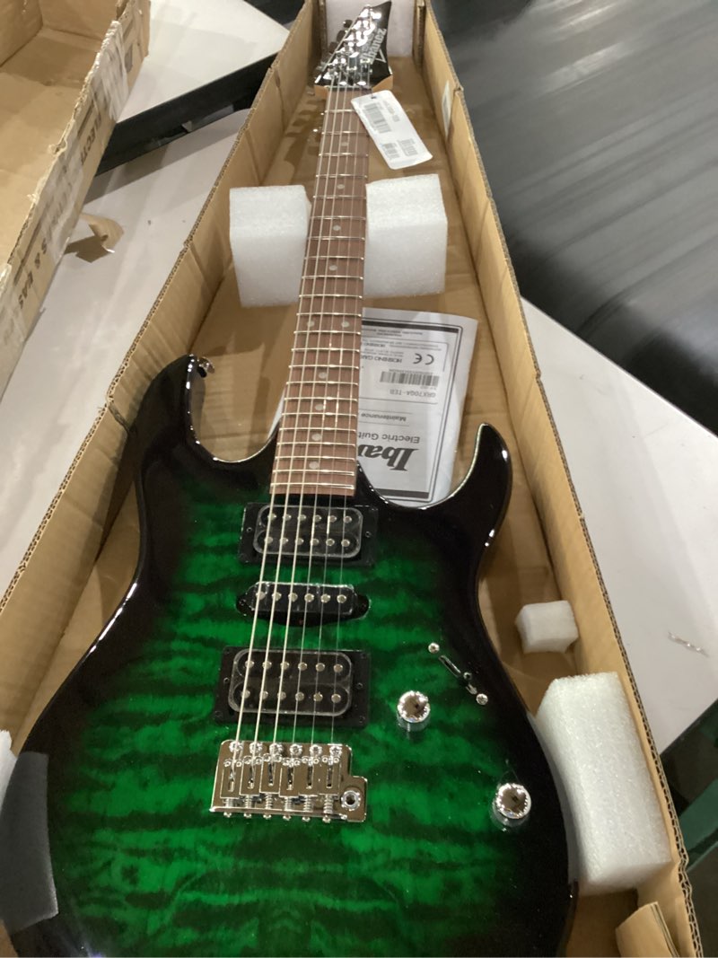 Condition photo showing New/Like New for ibanez gio series grx70qa - transparent emerald burst transparent emerald burst guitar