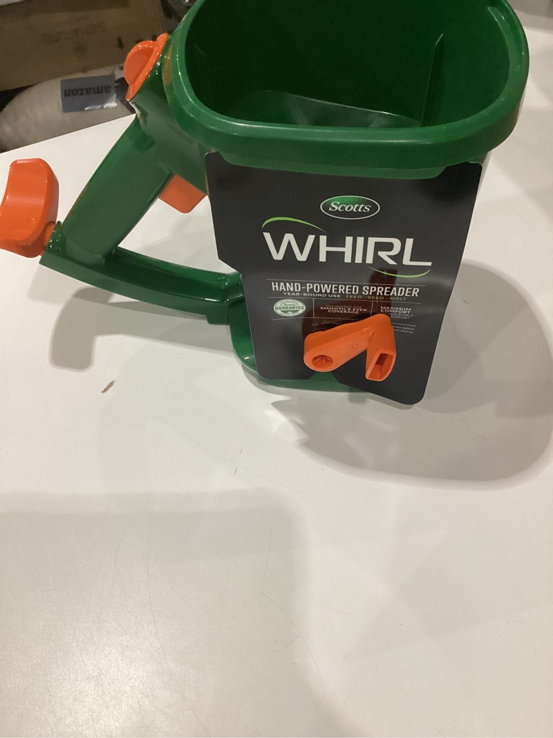 Condition photo showing Good Condition for scotts whirl hand-powered spreader - for grass seed, lawn fertilizers, salt, and ice melt, handheld spreader holds up to 1,500 sq. ft. of product