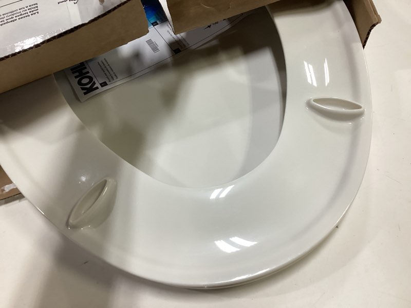 Condition photo showing As Is for kohler 20110-0 brevia, slow close toilet seat, elongated toilet seat, grip-tight bumpers quick-attach hardware, white white elongated quiet-close