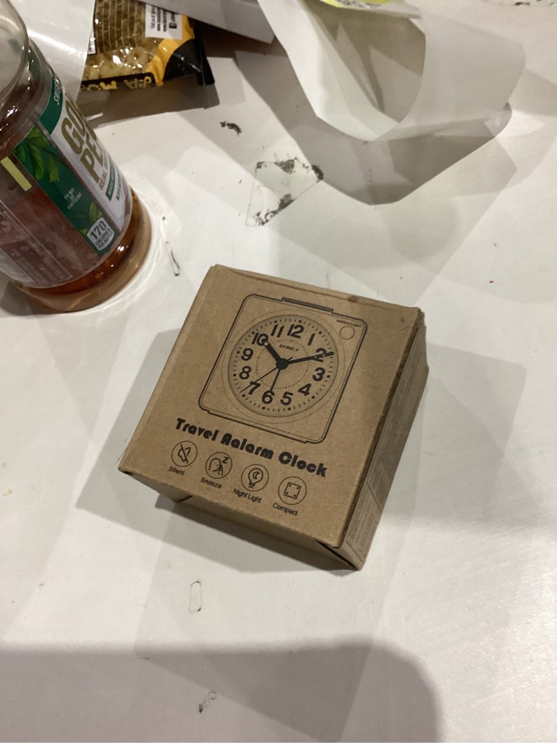 Condition photo showing New/Like New for AYRELY® 2.6" × 1.4" Ultra Small Battery Operated Analog Travel Alarm Clock, Silent Non-Ticking with Snooze and Light, Retro Bedside Table Clock for Bedroom, Easy Top Alarm Switch (Silver)