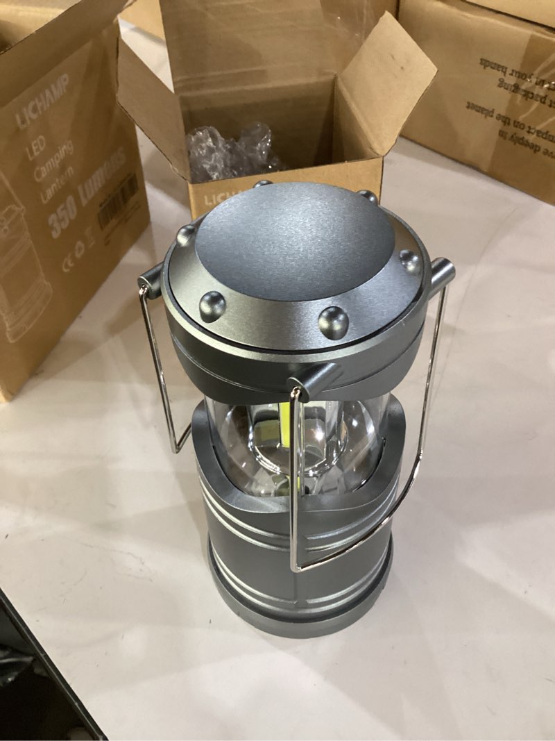Condition photo showing Good Condition for lichamp led camping lantern, 4 pack battery powered flashlight for power outages, portable collapsible hanging light essential for home, outdoor, emergency lamp survival kit gear for hurricane, gray dark gray