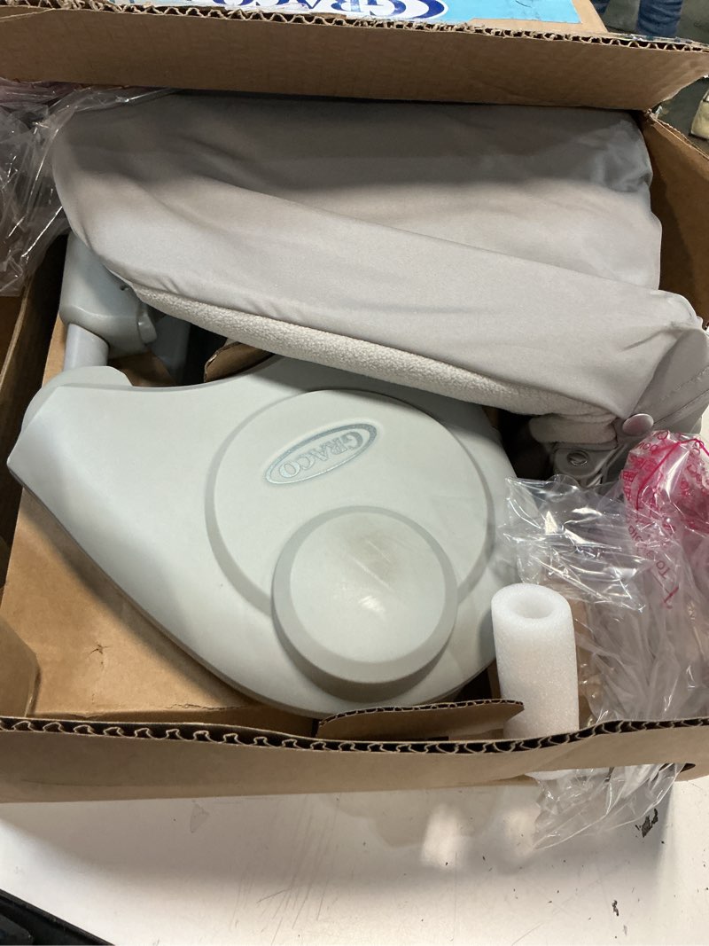 Condition photo showing As Is for Graco Slim Spaces Compact Baby Swing, Space Saving Portable Bay Swing with Height Adjustable Legs & Soft Toys, Reign