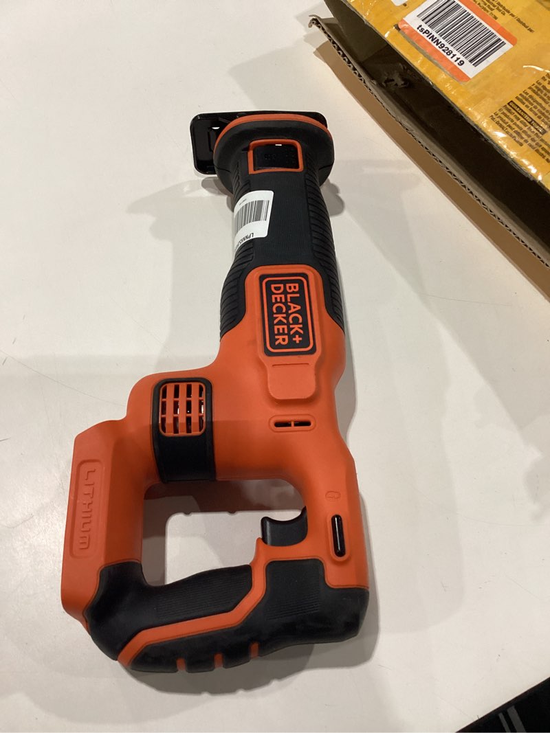 Condition photo showing As Is for NOT TESTED ONLY THE MAIN SECTION NO BLADE NO BATTERY NO CORD BLACK+DECKER 20V MAX* Cordless Reciprocating Saw Kit (BDCR20C)