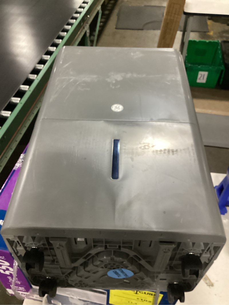 Condition photo showing As Is for ge 50-pint dehumidifier with built-in pump for basement, garage or wet rooms up to 4500 sq. ft. in grey, energy star