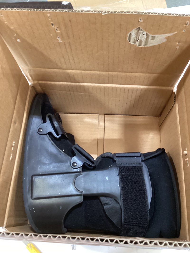 Condition photo showing As Is for united ortho short air cam walker fracture boot, large, black black large boot
